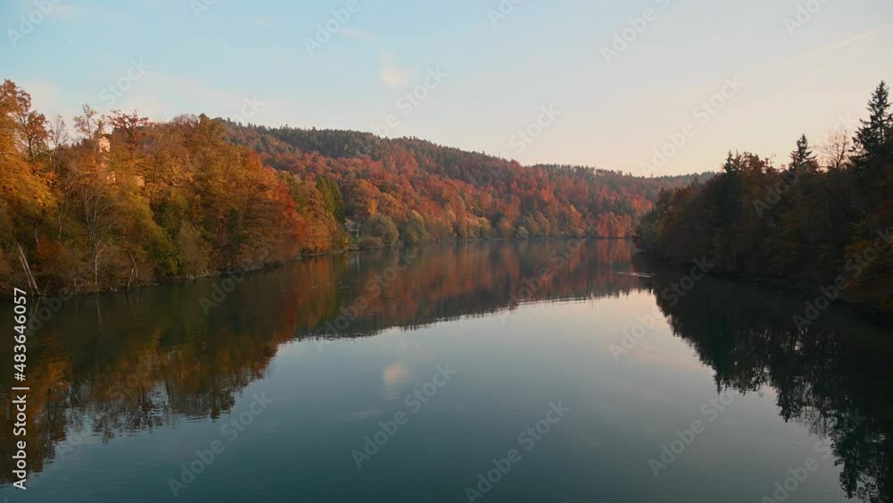Elevated view of calm Sava River in Slovenia. Banks covered with colorful trees in autumn. Real time, static shot Elevated view of calm Sava River in Slovenia. Banks covered with colorful trees in autumn. Real time, static shot