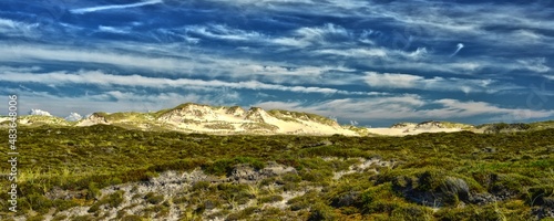Idyllic huge wander dunes with sunlight beautiful clouds and blue sky Sylt Germany