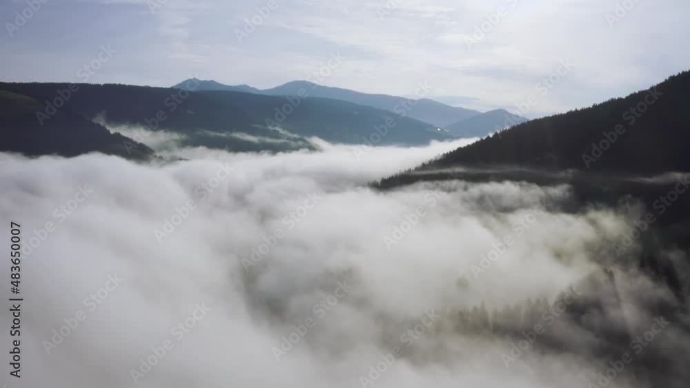 Flying through the clouds above mountain tops. High peaks wonderful morning sunrise natural Landscape Flying through the clouds above mountain tops. High peaks wonderful morning sunrise natural Landscape