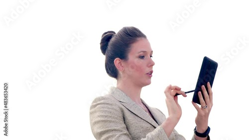 Businesswoman uses stylus on tablet on white background.