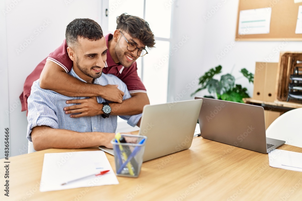 Young couple smiling happy working at the office. Young couple smiling happy working at the office.