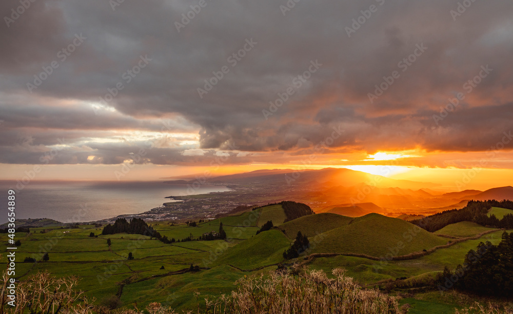 Amazing sunrise, view over the island, Azores travel destination.