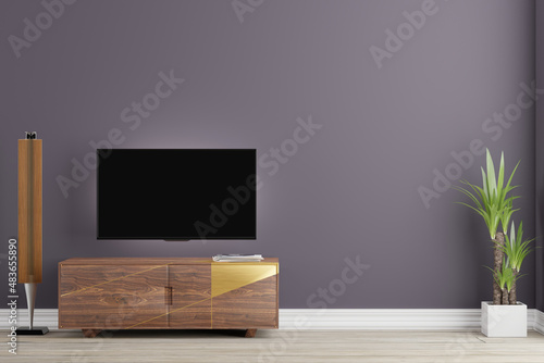 modern living room with tv with blank dark screen, wooden tv stand, light grey wooden floor, white skirting and clean greyish puprple wall with green plant on the floor