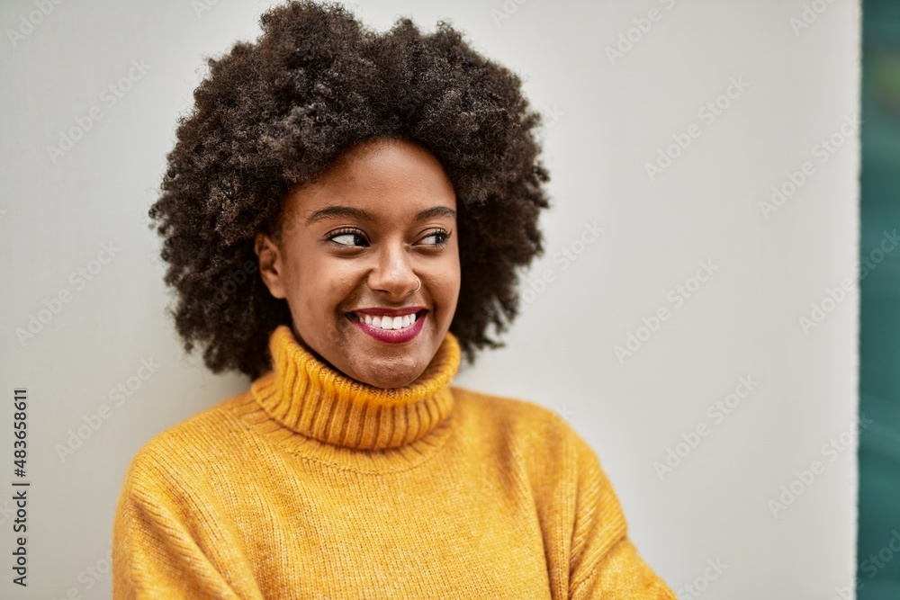 Young african american girl smiling happy standing at the city. Young african american girl smiling happy standing at the city.