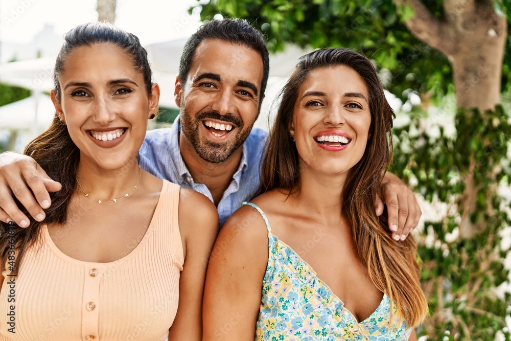 Three hispanic friends smiling happy and hugging at the city. Three hispanic friends smiling happy and hugging at the city.