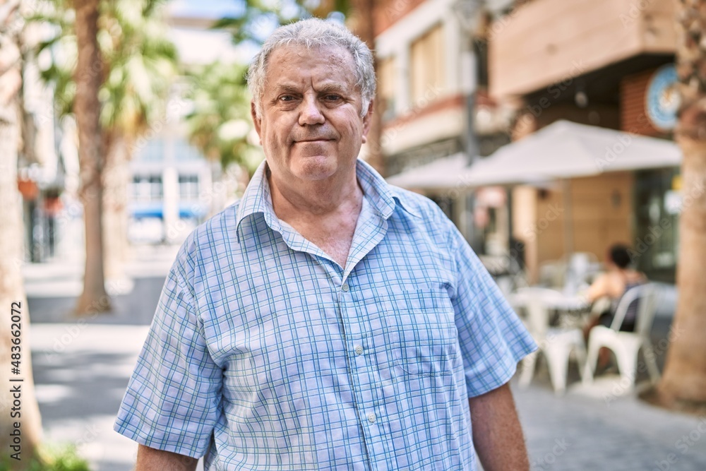 Middle age grey-haired man smiling confident walking at street Middle age grey-haired man smiling confident walking at street