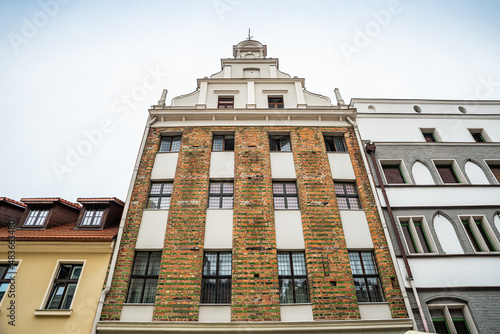 Torun, Poland - August 11, 2021. One of the oldest buildings - Dawny dom kompanijny kupcow bractwa Mariackiego - in street Zeglarska nr 5