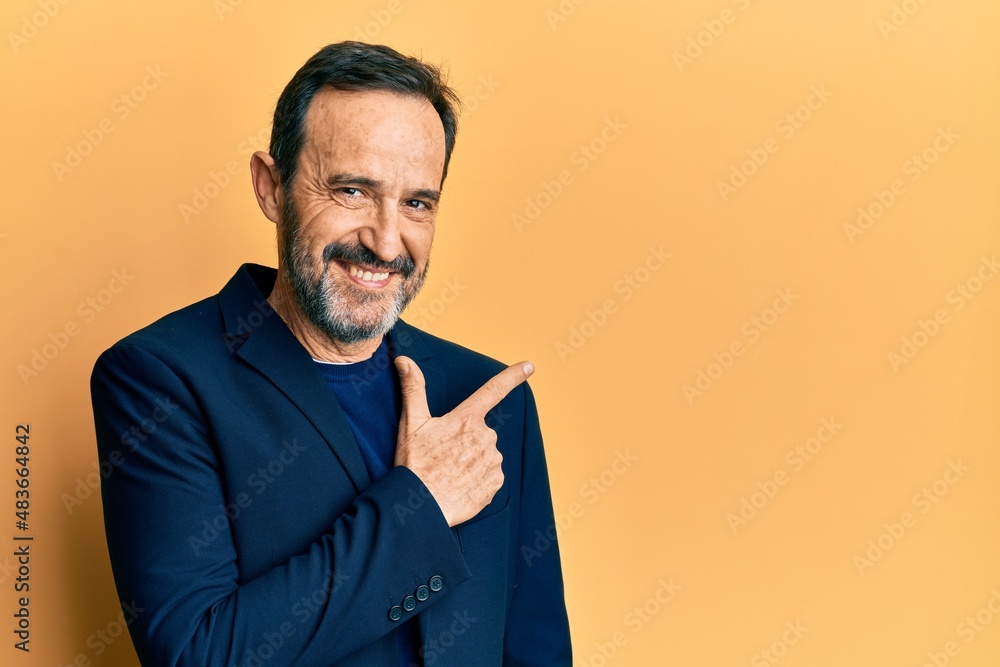 Middle age hispanic man wearing business clothes smiling cheerful pointing with hand and finger up to the side Middle age hispanic man wearing business clothes smiling cheerful pointing with hand and finger up to the side