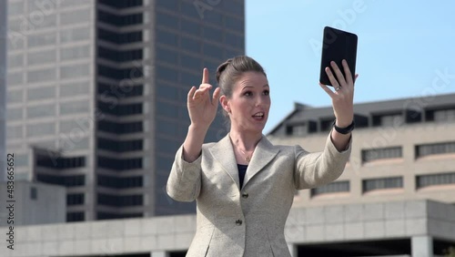 Businesswoman uses video chat on her tablet