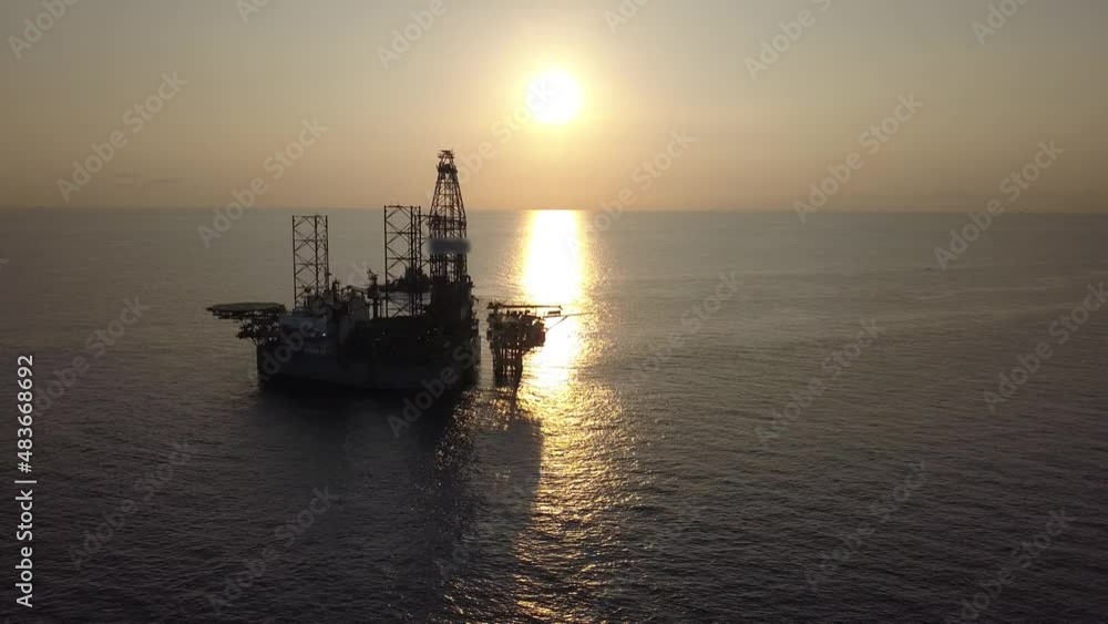Aerial view from a drone of an offshore jack up rig at the offshore location during sunrise time
Aerial view from a drone of an offshore jack up rig at the offshore location during sunrise time