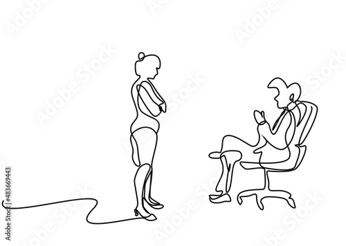 male boss talking to female employee with legs crossed angrily