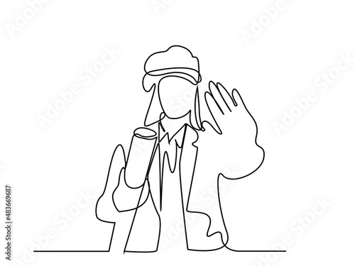 female architect holding her project and making a stop sign with her other hand