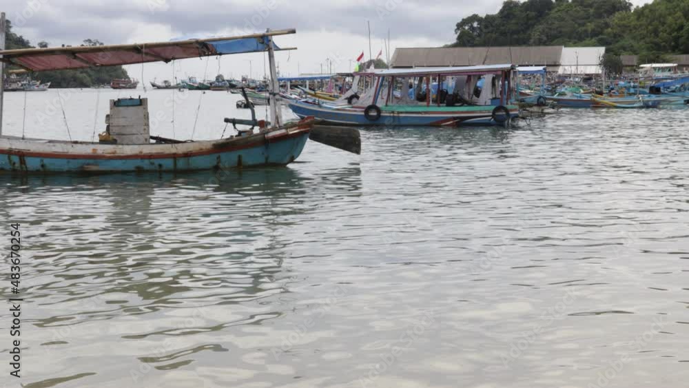 indonesia tourist boat on the sea coast of the tropical island of bali. Exotic Asian travel destination background indonesia tourist boat on the sea coast of the tropical island of bali. Exotic Asian travel destination background