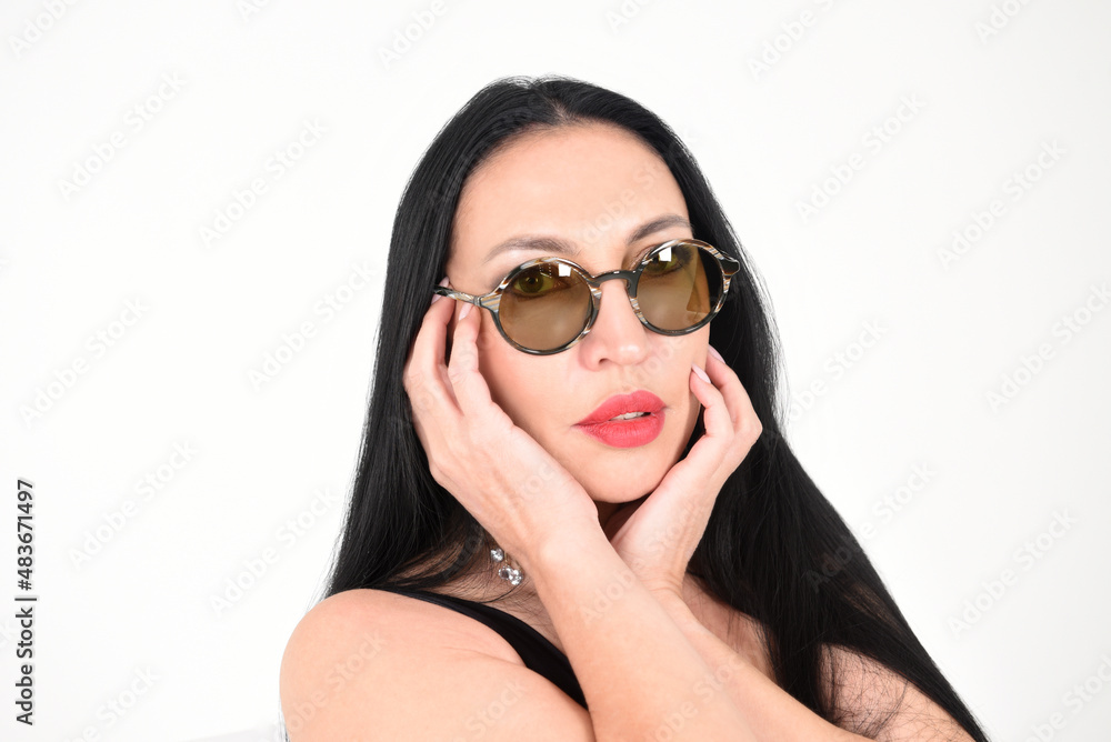 Face or portrait of a beautiful stylish brunette girl on a white background in the studio Face or portrait of a beautiful stylish brunette girl on a white background in the studio