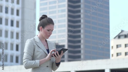 Frustrated Businesswoman working on tablet