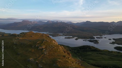 Aerial View Of Loch Maree And Beinn Eighe Mountainscape In Scotland. Dolly Forward Rising Tilt Down photo