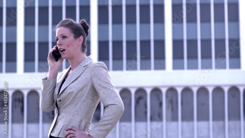 Sharp Businesswoman having phone conversation