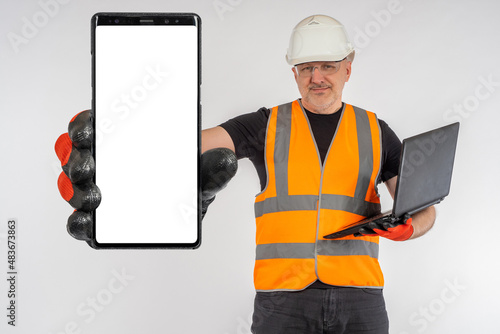 Phone screen in hand of bui...
