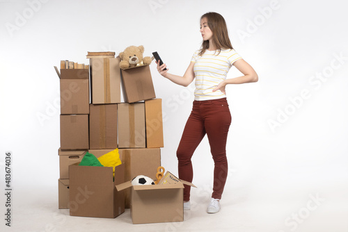 Old things in boxes. Girl w...