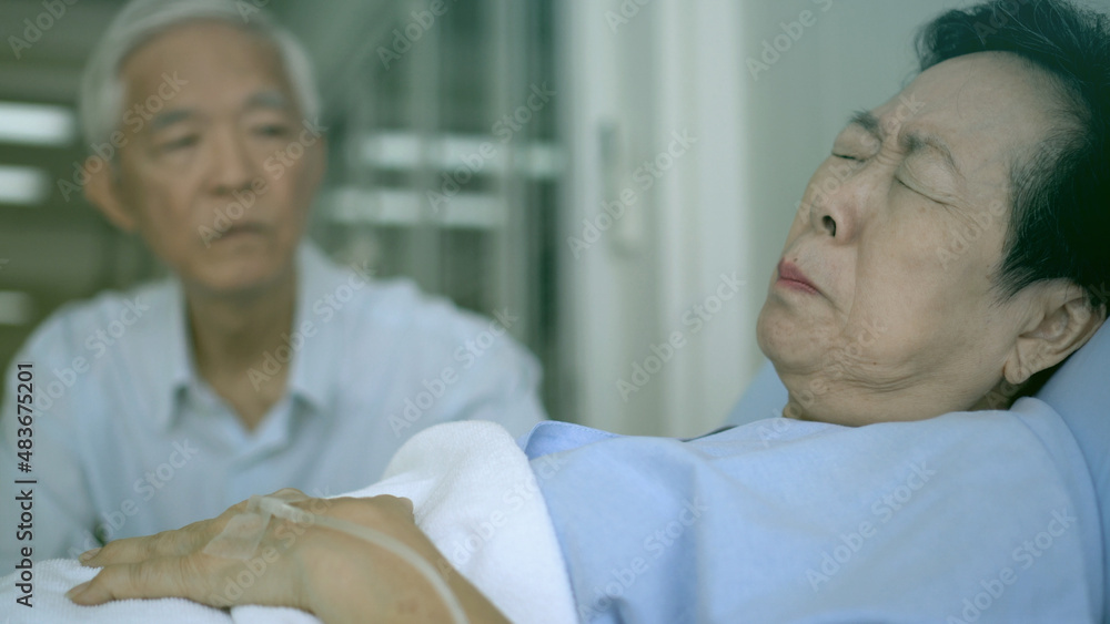 Senior elder husband visitng sick wife at hospital worry about medical treatment Senior elder husband visitng sick wife at hospital worry about medical treatment