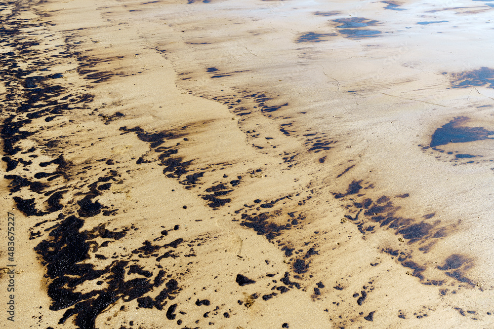 Texture of Crude Oil spill reaches shoreline from pipeline leak accident on Mae Ramphueng Beach, Rayong province, Thailand. Texture of Crude Oil spill reaches shoreline from pipeline leak accident on Mae Ramphueng Beach, Rayong province, Thailand.