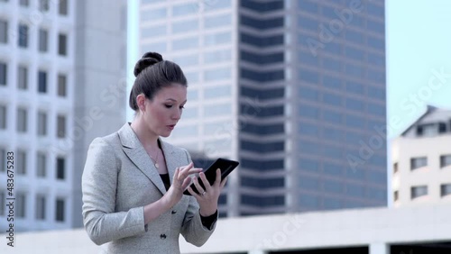 Stressed American Businesswoman working on tablet