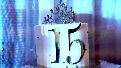 Birthday cake of quinceañera and a crown on top 