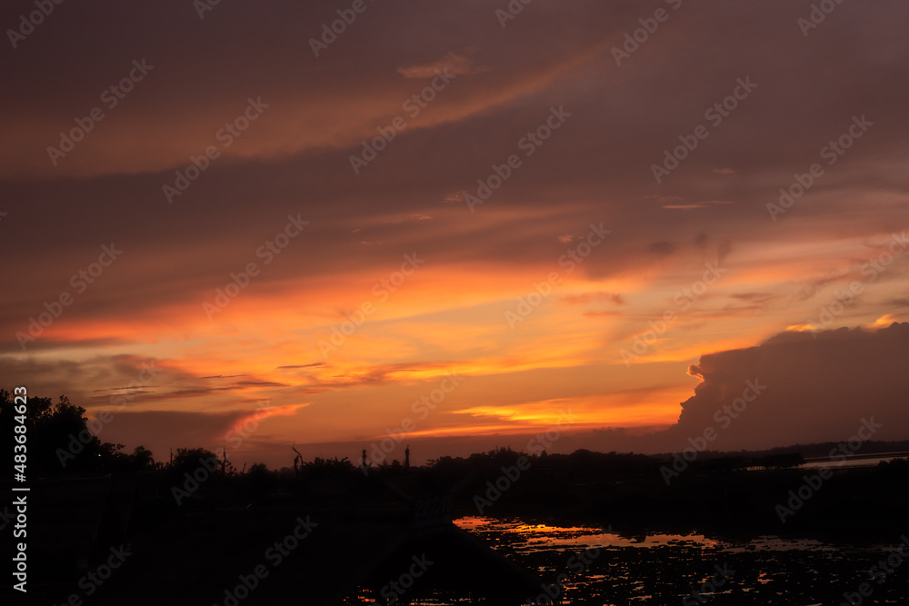 Blurred Sunset on river nature background.