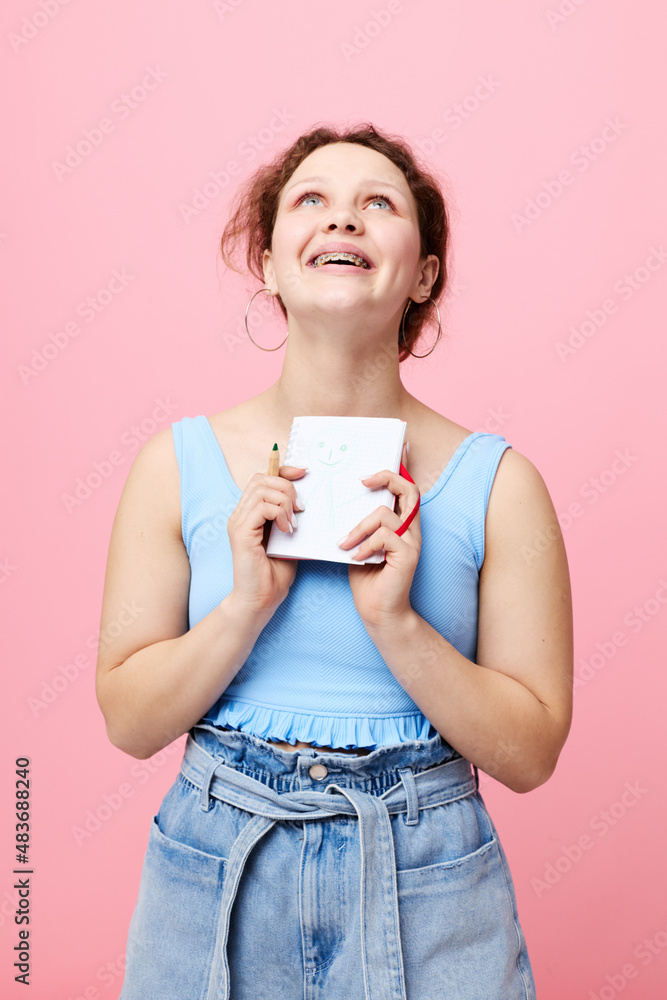 attractive woman learning with notebook and pen close-up unaltered attractive woman learning with notebook and pen close-up unaltered