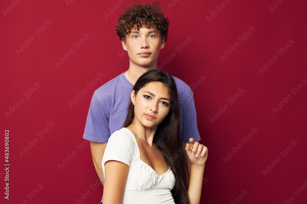 young man and girl summer style posing fashion emotions red background young man and girl summer style posing fashion emotions red background