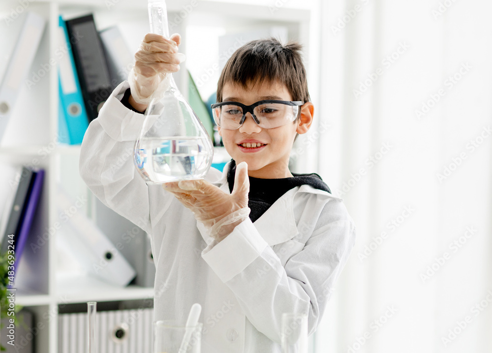 School boy in chemistry class School boy in chemistry class