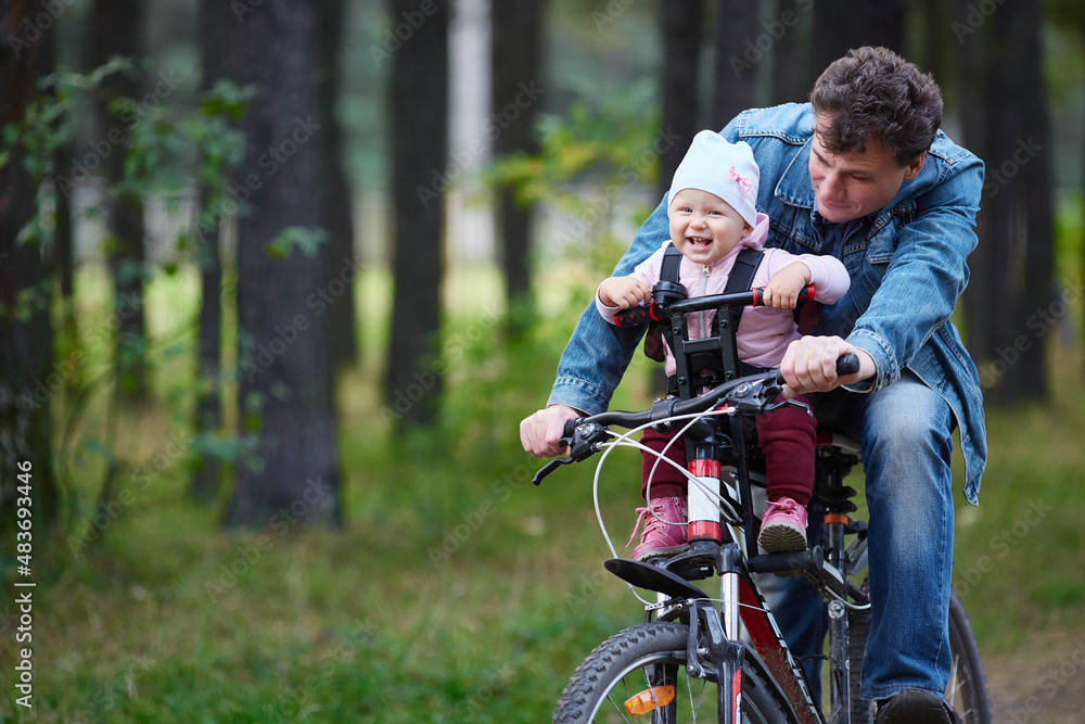 family bike ride through the forest on a weekend.