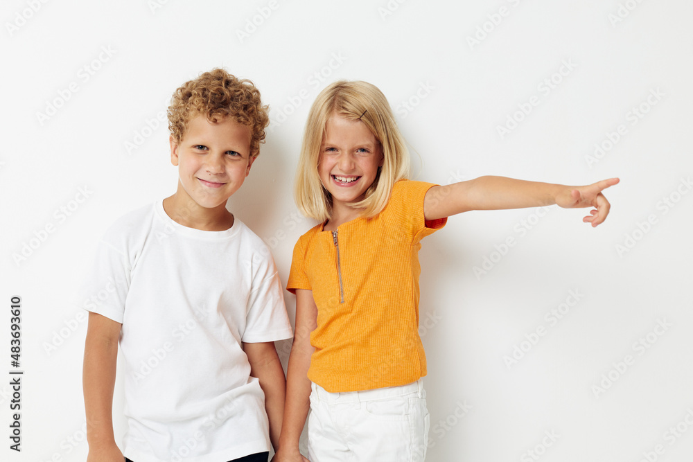 Cute stylish kids fun gestures with hands emotions childhood light background Cute stylish kids fun gestures with hands emotions childhood light background