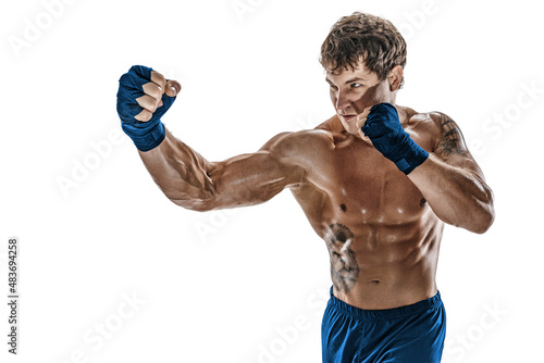 Portrait of male boxer who training and practicing right hook on white background. Blue sportswear