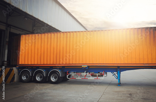 Trailer Cargo Container Trucks Parked Loading at Dock Warehouse. Shipment. Packaging Boxes Supply Chain. Distribution Warehouse Shipping . Lorry. Cargo Freight Truck Transport Logistics. 