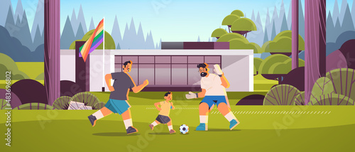 male parents playing football with little son gay family transgender love LGBT community concept