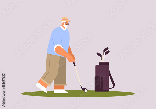 senior man playing golf aged player taking a shot active old age concept horizontal