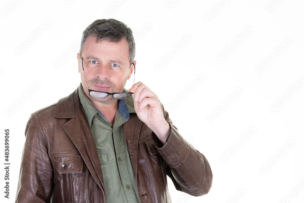 Portrait of confident man wearing glasses and vest leather jacket Portrait of confident man wearing glasses and vest leather jacket