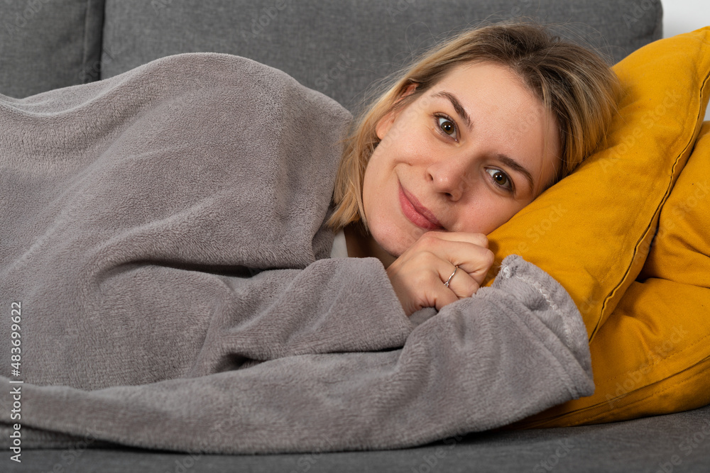Sick woman lying on the couch Sick woman lying on the couch
