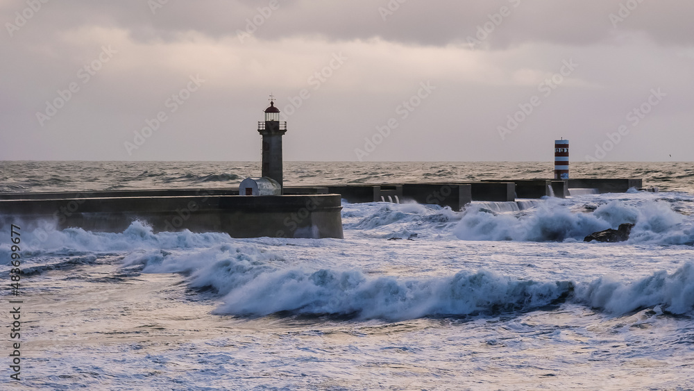 Lighthouse with big wave at Atlantic ocean, Porto