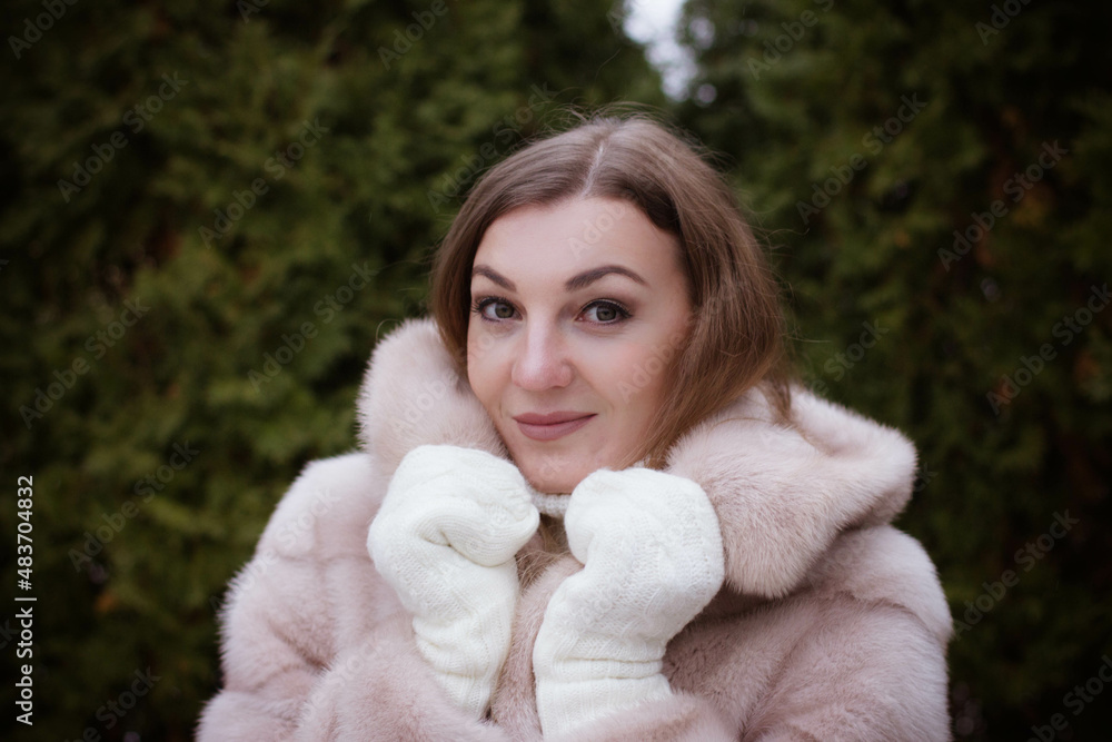 portrait of a girl in winter in a fur coat portrait of a girl in winter in a fur coat
