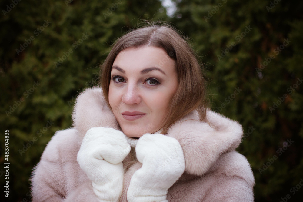portrait of a girl in winter in a fur coat portrait of a girl in winter in a fur coat