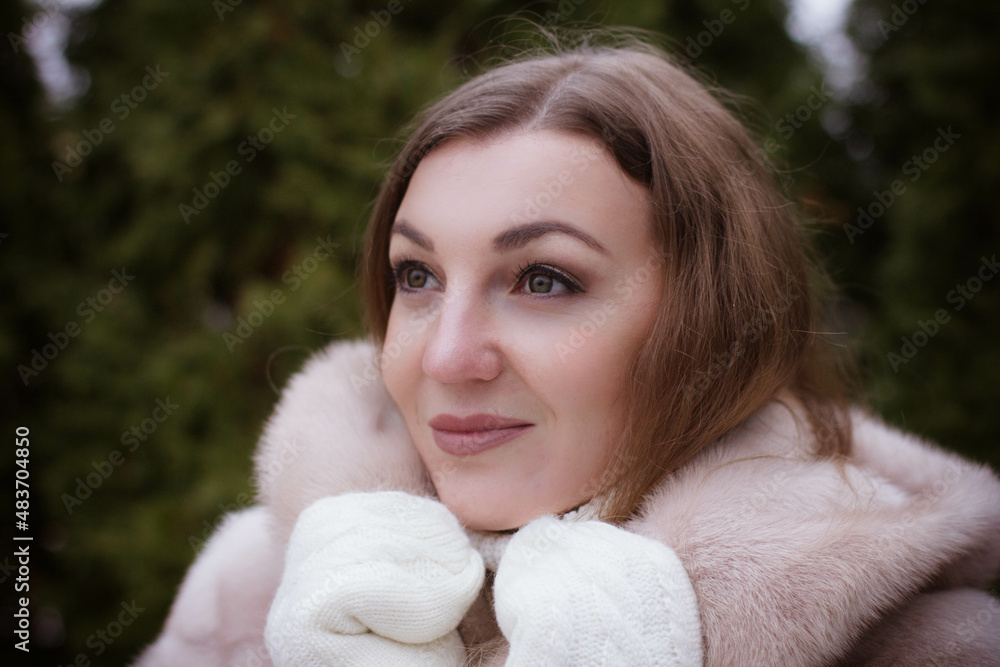 portrait of a girl in winter in a fur coat portrait of a girl in winter in a fur coat