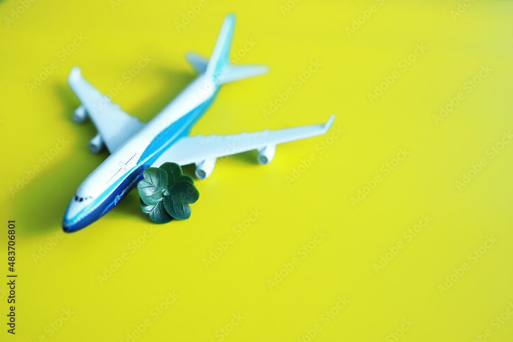 St. patrick's day background. Religious Christian Irish celebration. Four-leaf clover symbol of good luck with airplane. St. patrick's day background. Religious Christian Irish celebration. Four-leaf clover symbol of good luck with airplane.