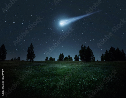 Fotografie, Tablou Night scene with a comet, asteroid, meteorite flying to Earth