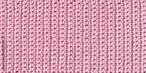 Texture of crocheted fabric of pink threads
