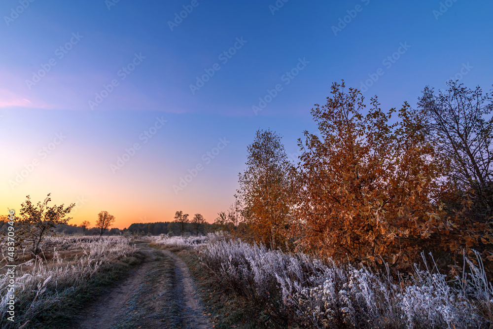 Misty morning in a field. Quiet, autumn sunrise over the field. Beautiful landscape. First sunny rays. Misty morning in a field. Quiet, autumn sunrise over the field. Beautiful landscape. First sunny rays.
