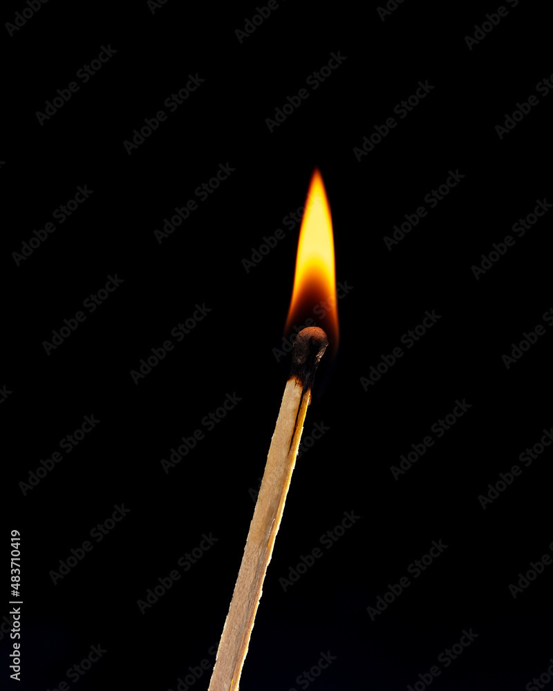 Burning match isolated on black background. Close-up. Burning match isolated on black background. Close-up.