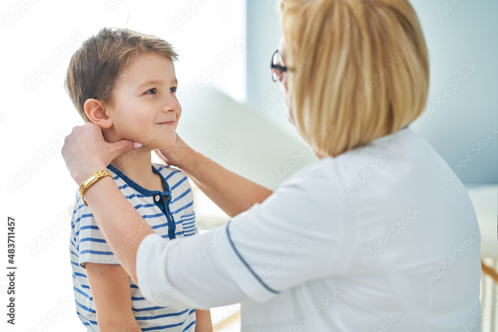 Pediatrician doctor examining little kids in clinic Pediatrician doctor examining little kids in clinic