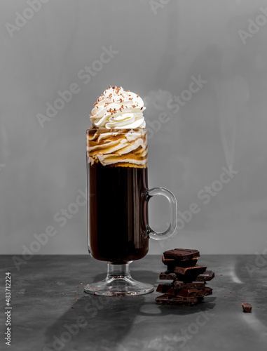 Irish coffee on a grey slate background